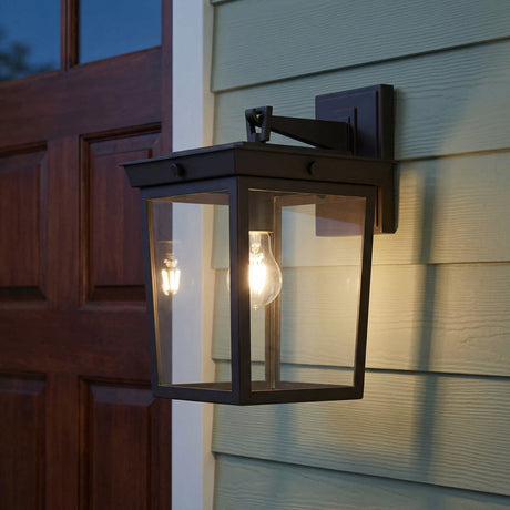 Radcliffe Outdoor Wall Light, Medium 14", Old Bronze geometric Outdoor Wall Light in a Craftsman entryway with green siding and wood door.