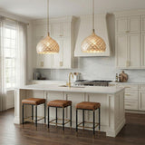 A transitional kitchen features two Valentina Large Pendant 21", Soft Brass and Capiz Shell fixtures over a white marble island with leather stools and cream cabinetry.