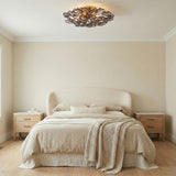 Layla Semi-Flush 22", Smoke Glass Gold scalloped Flush Mount in a Contemporary Bedroom with a cream headboard and oak nightstands.