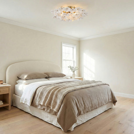 Layla Semi-Flush 22", White Glass Gold scalloped leaf design Flush Mount in a Transitional Bedroom with a neutral boucle headboard.