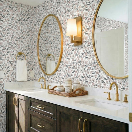 Sutton Aged Brass geometric Wall Sconce in a Traditional Bathroom with floral wallpaper and a double vanity.