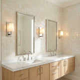 Fyn Wall Sconce 12", Chrome and with Opal Glass geometric Wall Sconce in a Transitional Bathroom with a double vanity and marble counter.