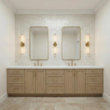 Dexter 2 Light Wall Sconce 29", Aged Brass linear wall sconce in a Transitional Bathroom with a wood double vanity and zellige tile.