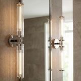 Dexter 2 Light Wall Sconce 29", Polished Nickel linear wall sconce in a Contemporary Bathroom with stone tile and mirror.