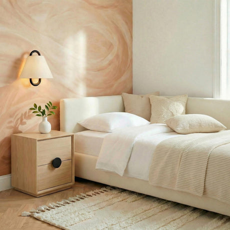 Sora Matte Black geometric Wall Sconce in a Contemporary Bedroom with textured cream bedding and a light oak nightstand.