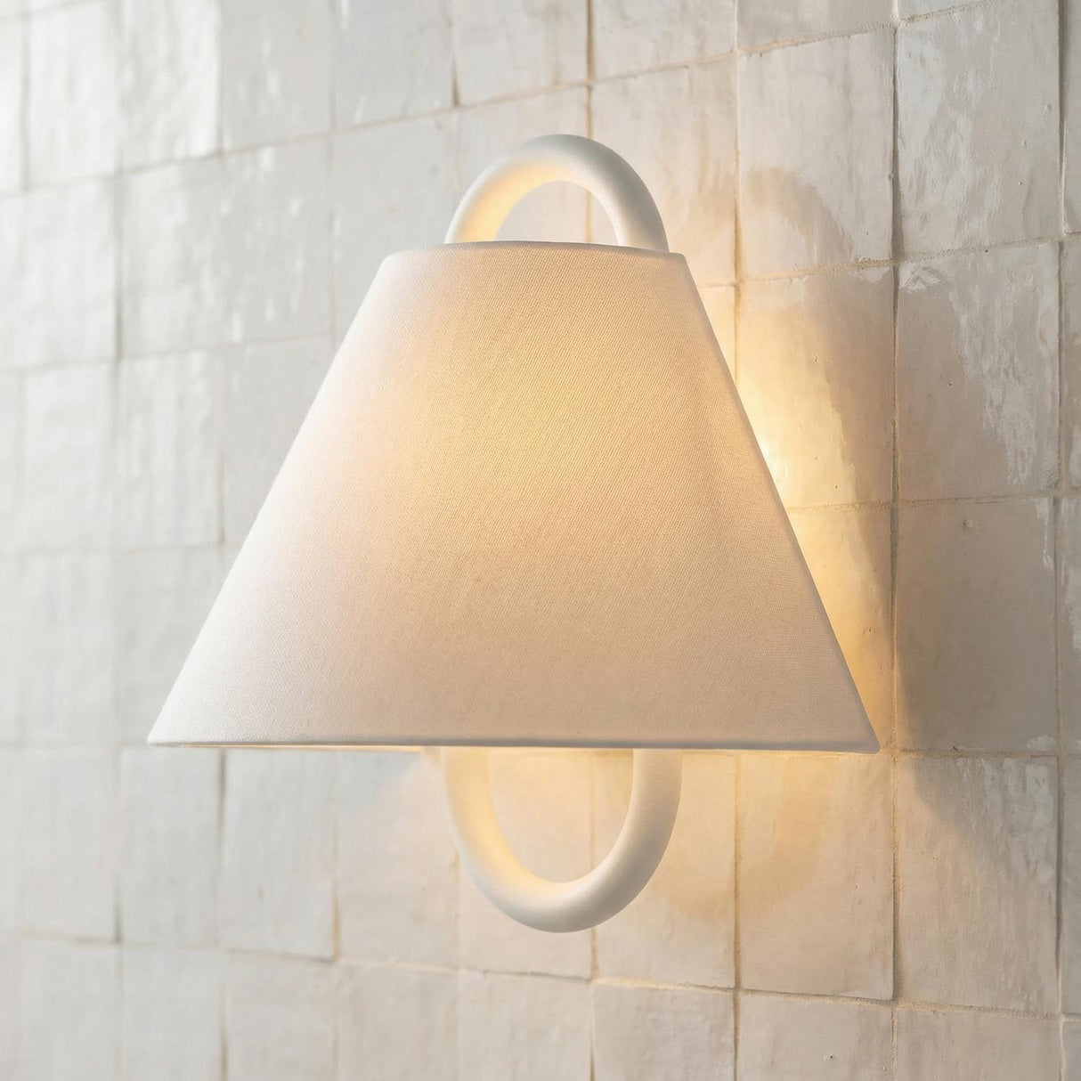 Lucia Wall Sconce 12", Matte White geometric Wall Sconce in a Contemporary Bathroom with a textured Zellige tile wall.