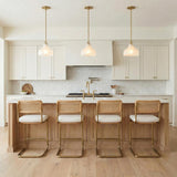 Claire Small Pendant 10", Brass and Strie Glass Gold scalloped Pendant in a Modern Farmhouse Kitchen with a marble island and cane stools.