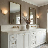 Claire Wall Sconce 9", Brass and Strie Glass scalloped wall sconce in a Transitional Bathroom with a double vanity and gold mirrors.