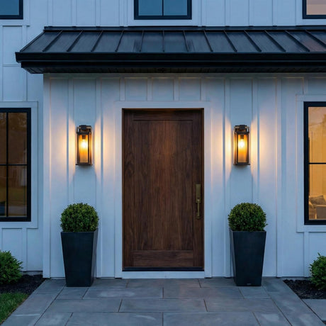 Harlow Matte Black and Gold geometric outdoor wall light in a Modern Farmhouse entryway with a dark wood door and black planters.