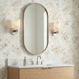 Elise Wall Sconce 11", Polished Nickel scalloped wall sconce in a Transitional Bathroom with floral wallpaper.