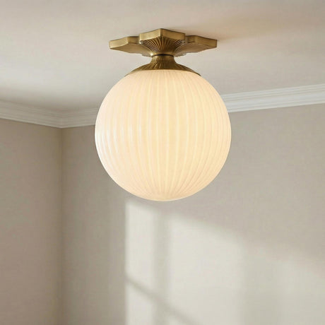 Victoria Semi-Flush 10", Aged Brass and Opal Ribbed Glass Aged Brass scalloped Semi-Flush in a Transitional Entryway with white crown molding.