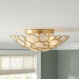 Aurelie Semi-Flush 16", Antique Gold with Capiz Shell scalloped Semi-Flush in a Coastal Bedroom with sage green walls and a Roman shade.