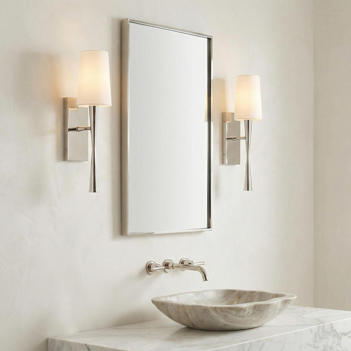 Kellan Wall Sconce 18", Polished Nickel linear Wall Sconce in a Transitional Bathroom with a marble countertop and stone vessel sink.