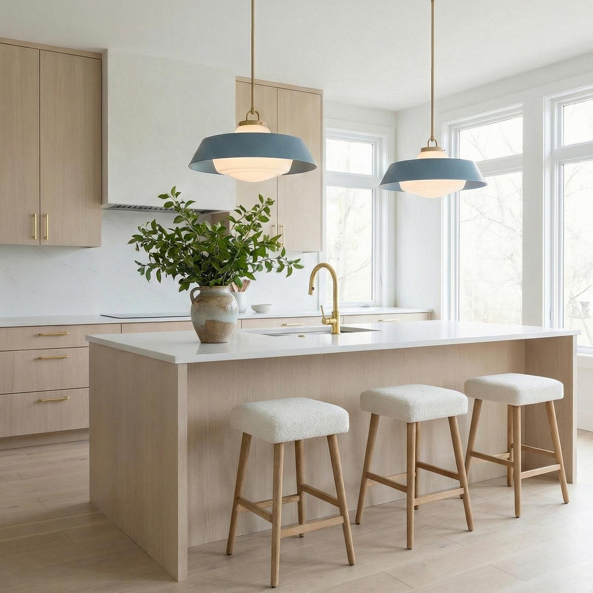 Blaine Large Pendant 20", Brass and Blue geometric pendant in a Modern Kitchen with a white marble island and boucle stools.