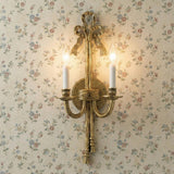 Etta 2 Light Wall Sconce 21", Heirloom Brass ribbon design Wall Sconce in a Traditional Hallway with floral wallpaper.