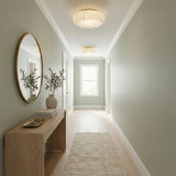 Clark LED Medium Flush Mount 16", Aged Brass and Alabaster globe flush mount in a Transitional Hallway with a wooden console table.