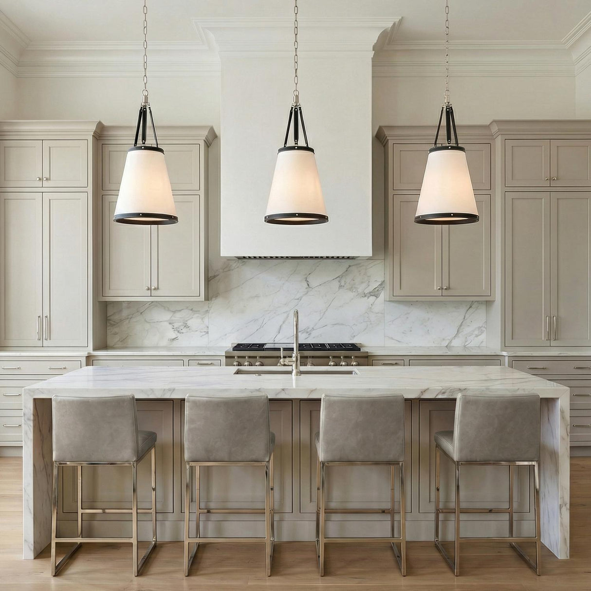 Spencer Pendant, Polished Nickel with Black Leather geometric pendant in a Transitional Kitchen with a white marble island.