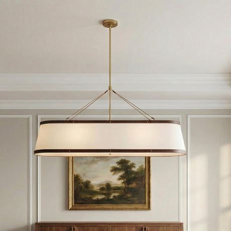 Spencer Linear Pendant, Brass with Brown Leather Accents linear Pendant in a Transitional Dining Room with a landscape oil painting.
