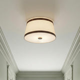 Spencer Flush Mount 17", Brass with Brown Leather Accents geometric Flush Mount in a Transitional Hallway with classic white crown molding.