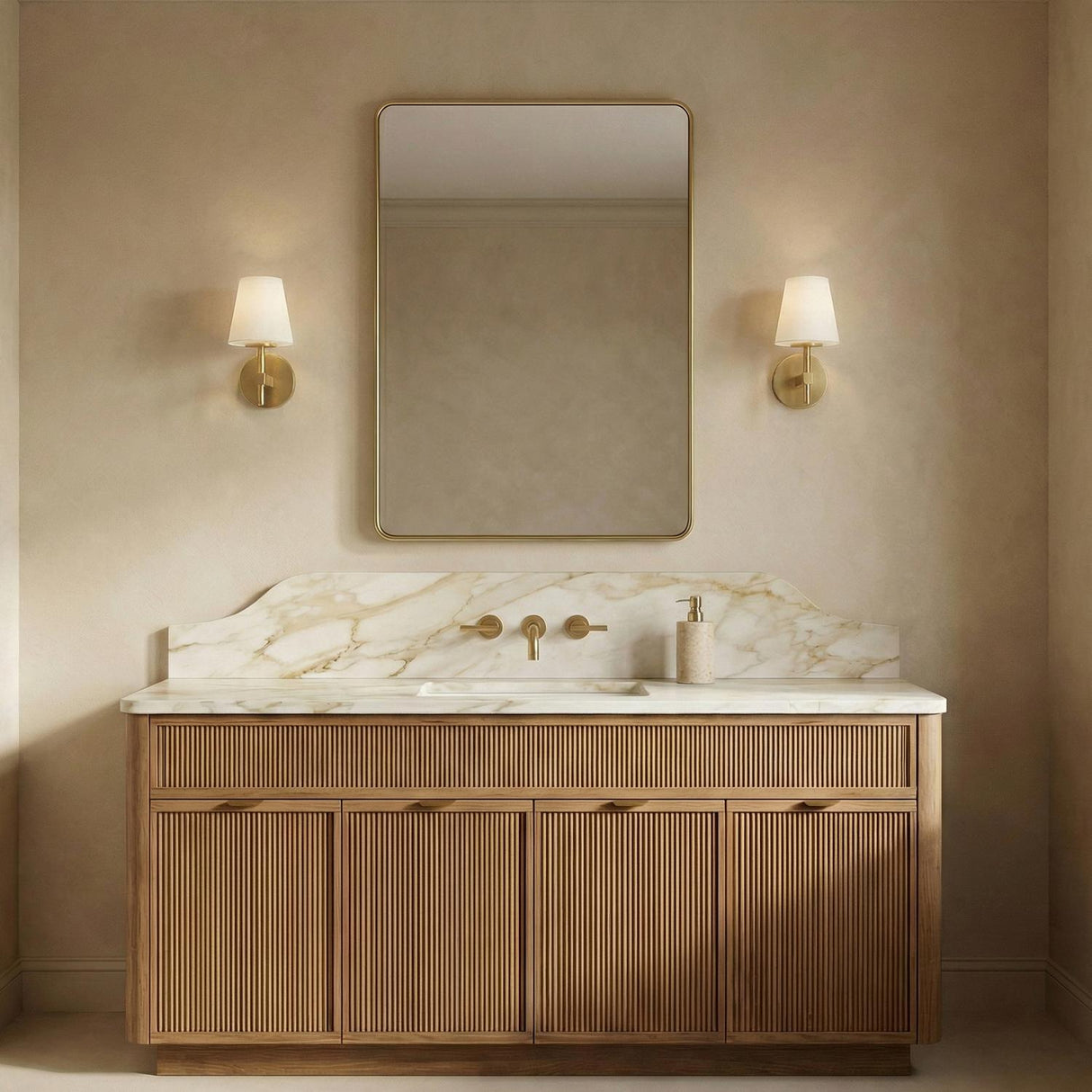 Atticus Brass geometric wall sconce in a Transitional Bathroom with a fluted wood vanity and marble backsplash.