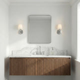 Atticus Wall Sconce 11", Chrome and Opal Glass geometric wall sconce in a Contemporary Bathroom with a fluted wood vanity and marble.