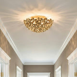 Florence Flush Mount, Soft Brass leaf design flush mount in a Transitional Hallway with white crown molding.