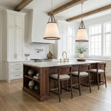 A transitional kitchen with two Spencer Large Pendant 21", Brass with Brown Leather Accents with linen shades over a walnut island under a beamed ceiling.