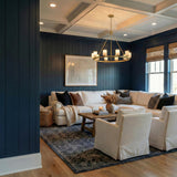 Arlo 10 Light Ring Chandelier 35", Soft Brass and Alabaster Brass geometric chandelier in a Coastal Living Room with navy paneled walls.