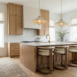 Jerico Soft Sand and Patina Brass geometric pendant in a Modern Farmhouse Kitchen with a white marble island.