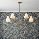 Yara 4 Light Chandelier, Patina Brass scalloped Chandelier in a Traditional Dining Room with blue floral wallpaper.