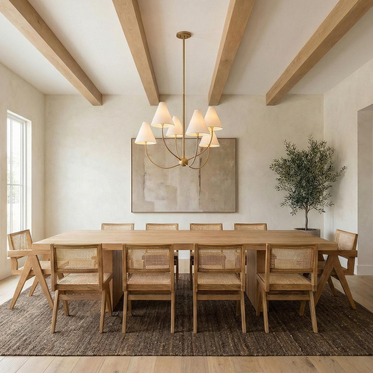 Yara 6 Light Chandelier 40", Patina Brass geometric Chandelier in a Transitional Dining Room with a rustic oak table and cane chairs.