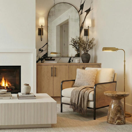 Pratt Single Wall Sconce 21", Old Bronze and Aged Brass linear Wall Sconce in a Contemporary Living Room with an arched mirror.