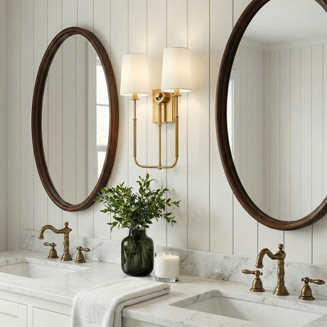 Pratt Double Wall Sconce 21", Aged Brass geometric wall sconce in a Modern Farmhouse Bathroom with a white marble double vanity.