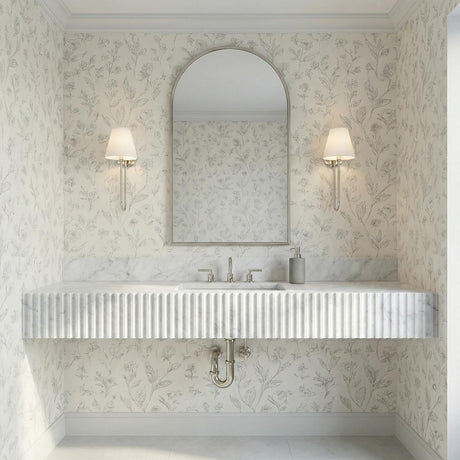 Harmony Wall Sconce 15" Polished Nickel linear Wall Sconce in a Transitional Bathroom with a fluted marble vanity and arched mirror.