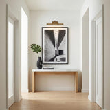 Roland LED Picture Light 16", Patina Brass linear Picture Light in a Modern Hallway with a marble top console and framed art.