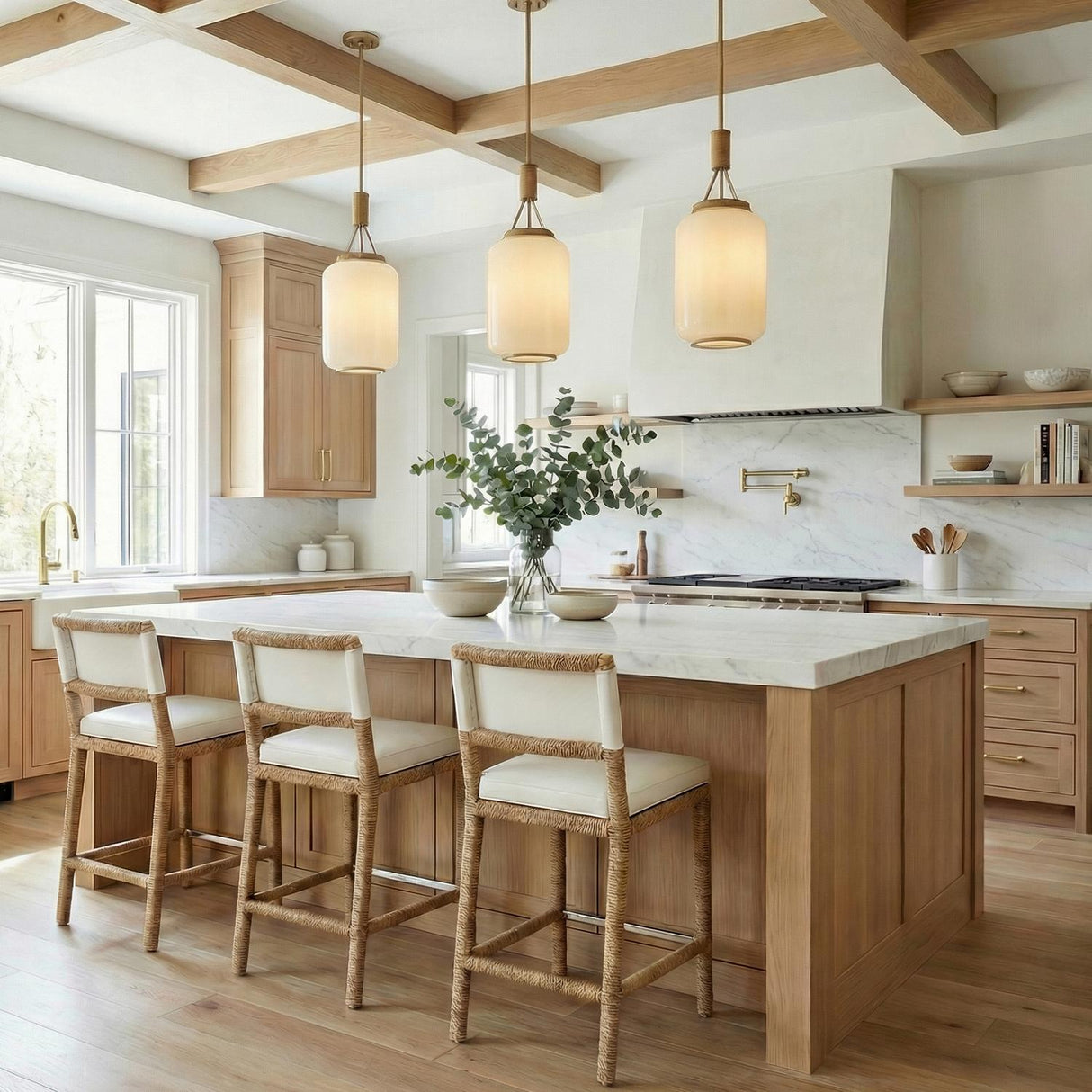 Yuma Pendant 10", Patina Brass and Rattan with Cream Milk Glass globe pendant in a Modern Farmhouse Kitchen with a white marble island.