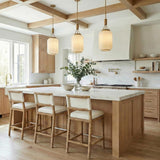 Yuma Pendant 10", Patina Brass and Rattan with Cream Milk Glass globe pendant in a Modern Farmhouse Kitchen with a white marble island.