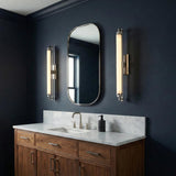 Empire LED Wall Sconce 28", Polished Nickel linear Wall Sconce in a Contemporary Bathroom with white marble vanity and navy walls.