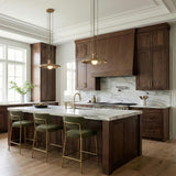 Titan Medium Pendant 16", Patina Brass geometric Pendant in a Transitional Kitchen with a white marble island and green bar stools.