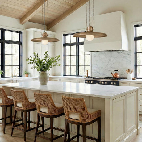 Titan Large Pendant 24", Patina Brass globe pendant in a Modern Farmhouse Kitchen with a white marble island and woven bar stools.
