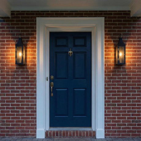 Yorktown Black geometric outdoor wall light in a Colonial outdoor entryway with a red brick wall and navy blue door.