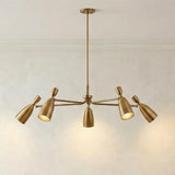Hyla 5 Light Chandelier 50", Patina Brass geometric Chandelier in a Mid-Century Dining Room with a textured plaster wall.