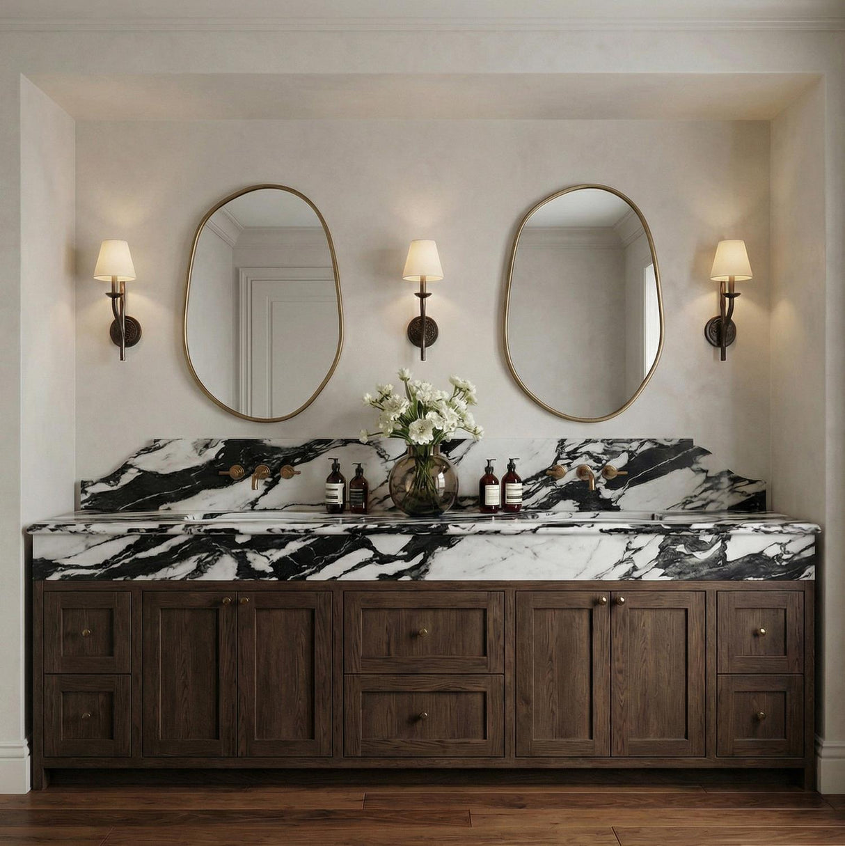 Valen Wall Sconce 19", Forged Bronze geometric Wall Sconce in a Transitional Bathroom with a black and white marble vanity.