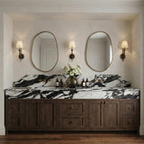 Valen Wall Sconce 19", Forged Bronze geometric Wall Sconce in a Transitional Bathroom with a black and white marble vanity.