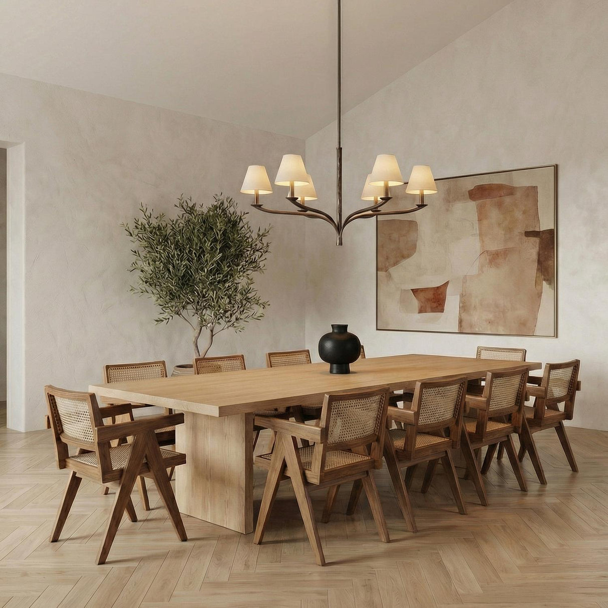 Valen 6 Light Chandelier 42", Forged Bronze linear Chandelier in a Transitional Dining Room with a light oak table and cane chairs.