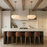Uma Fabric Pendant 22", Brushed Brass scalloped Pendant in a Modern Farmhouse Kitchen with a white marble island and leather stools.