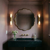 Alessio Medium Wall Sconce 18", Distressed Brass and Alabaster geometric Wall Sconce in a Transitional Bathroom with a scalloped mirror.