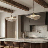 Celine Large LED Pendant 24", Polished Nickel and Clear Ribbed Glass scalloped pendant in a Modern Farmhouse Kitchen with a white marble island.