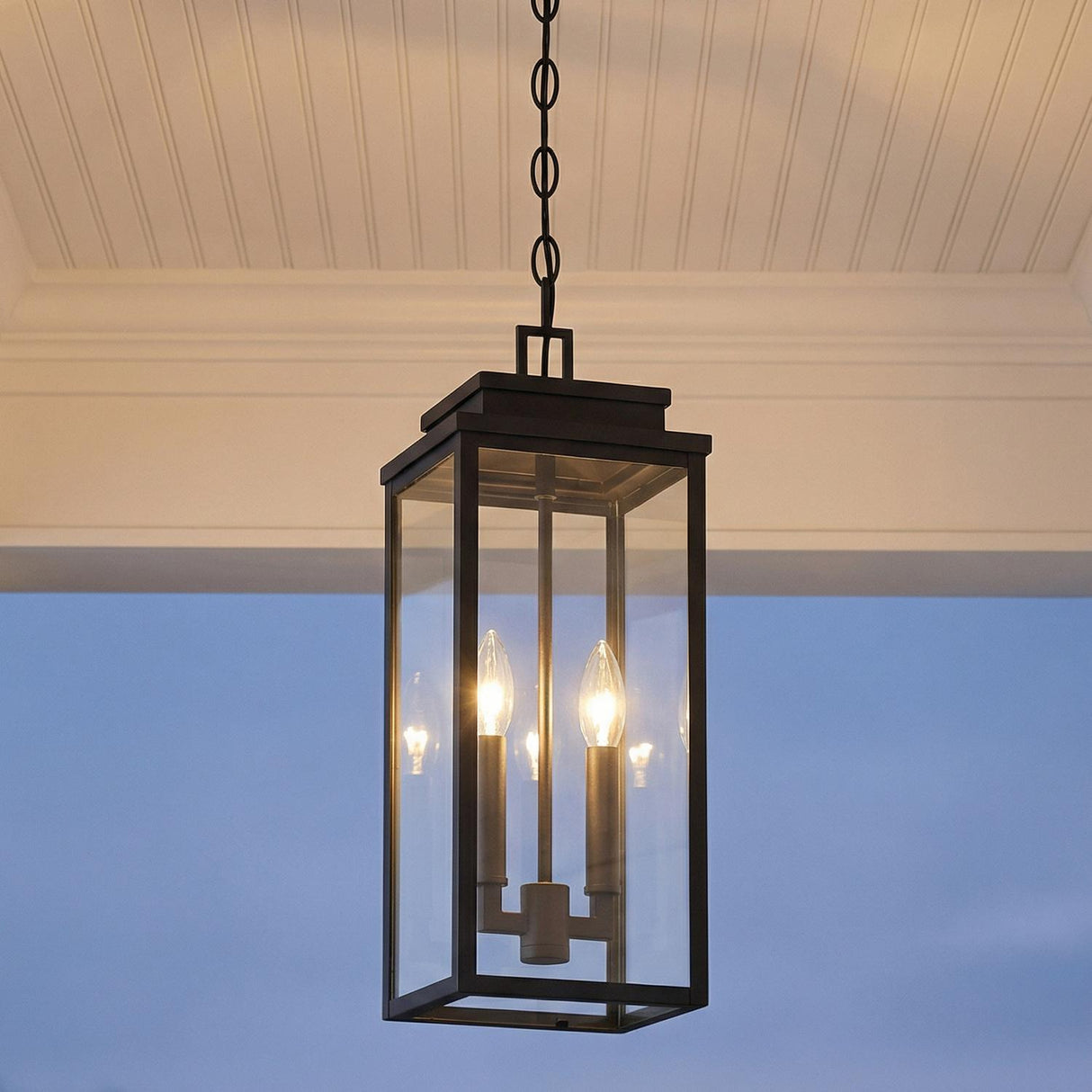 Trevor Outdoor Hanging Light, Medium 18", Black geometric Outdoor Hanging in a Modern Farmhouse Outdoor with a white beadboard ceiling.