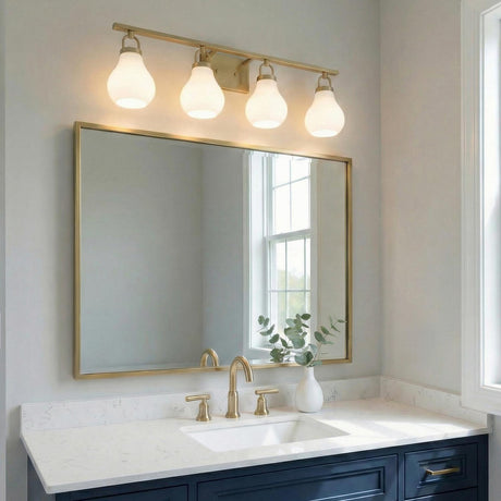 Naya 4 Light Vanity 34", Satin Brass and Opal Glass globe vanity in a Contemporary Bathroom with a navy vanity and marble counter.